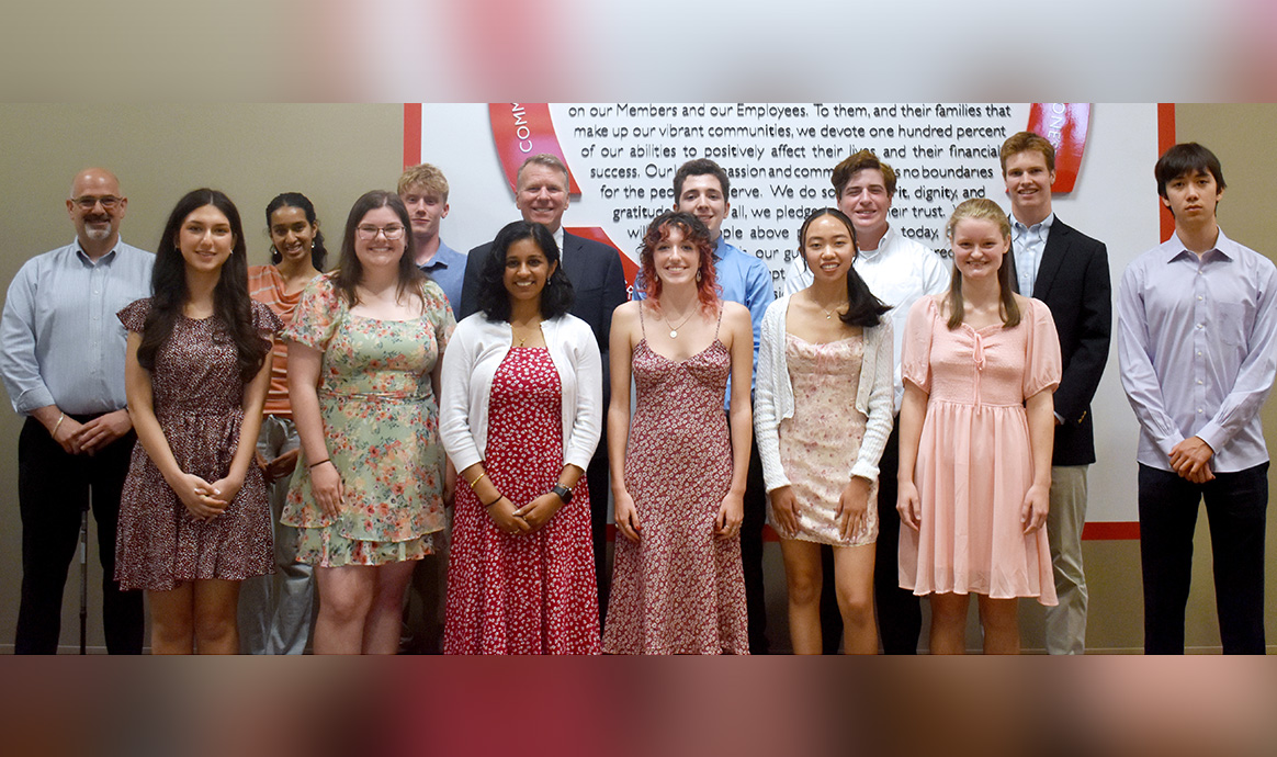 Several of MVCU’s annual scholarship winners smile with MVCU President & CEO John Howard and Brad Goodman, husband of the late Lisa Lewis Goodman, during the awards ceremony held at the credit union’s corporate office in Lawrence, Mass. 